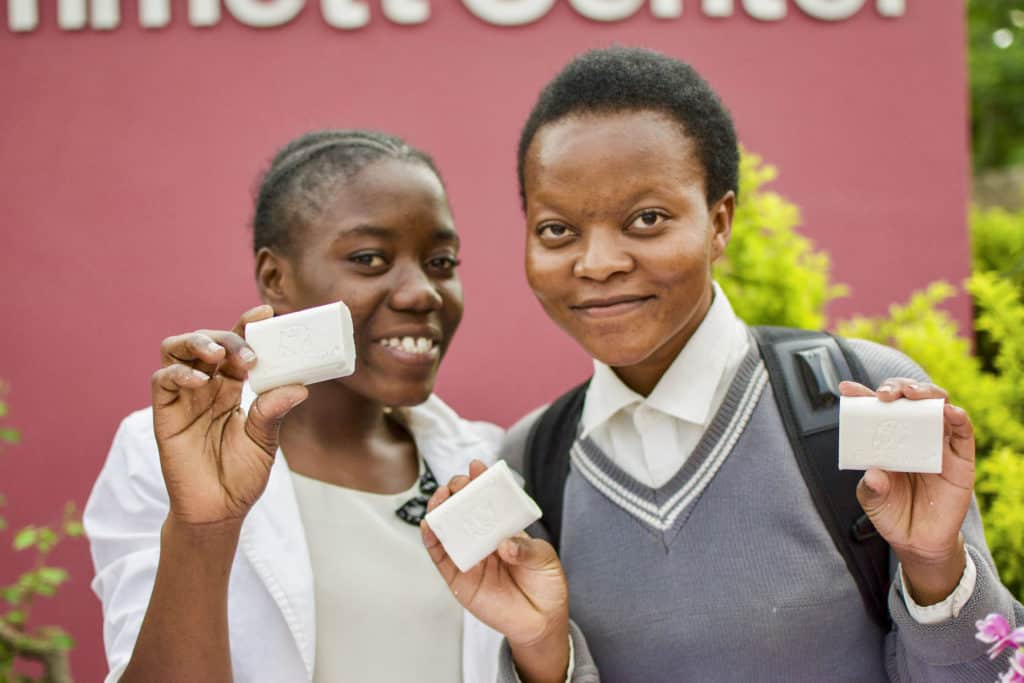 Zambian girls holding Clean the World soap